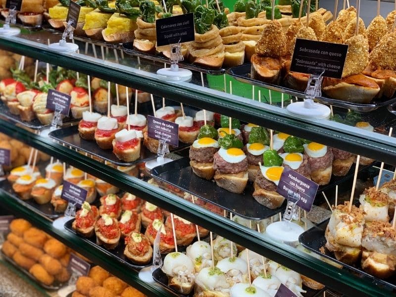 A display of Spanish tapas, one of the main reasons Granada is worth visiting.